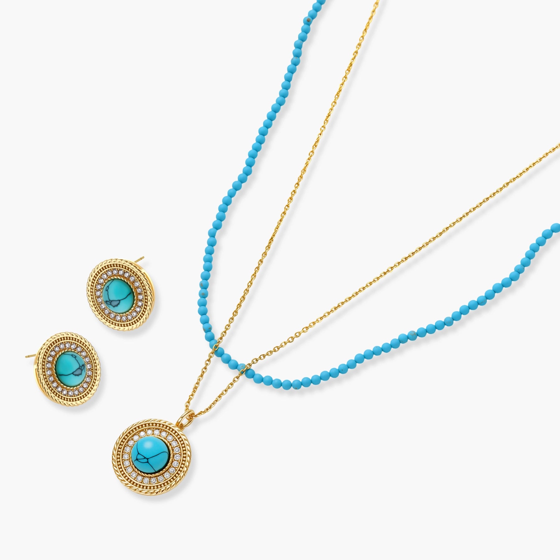 Gold-plated turquoise jewelry set with circular medallion pendant, beaded necklace, and matching stud earrings on white background