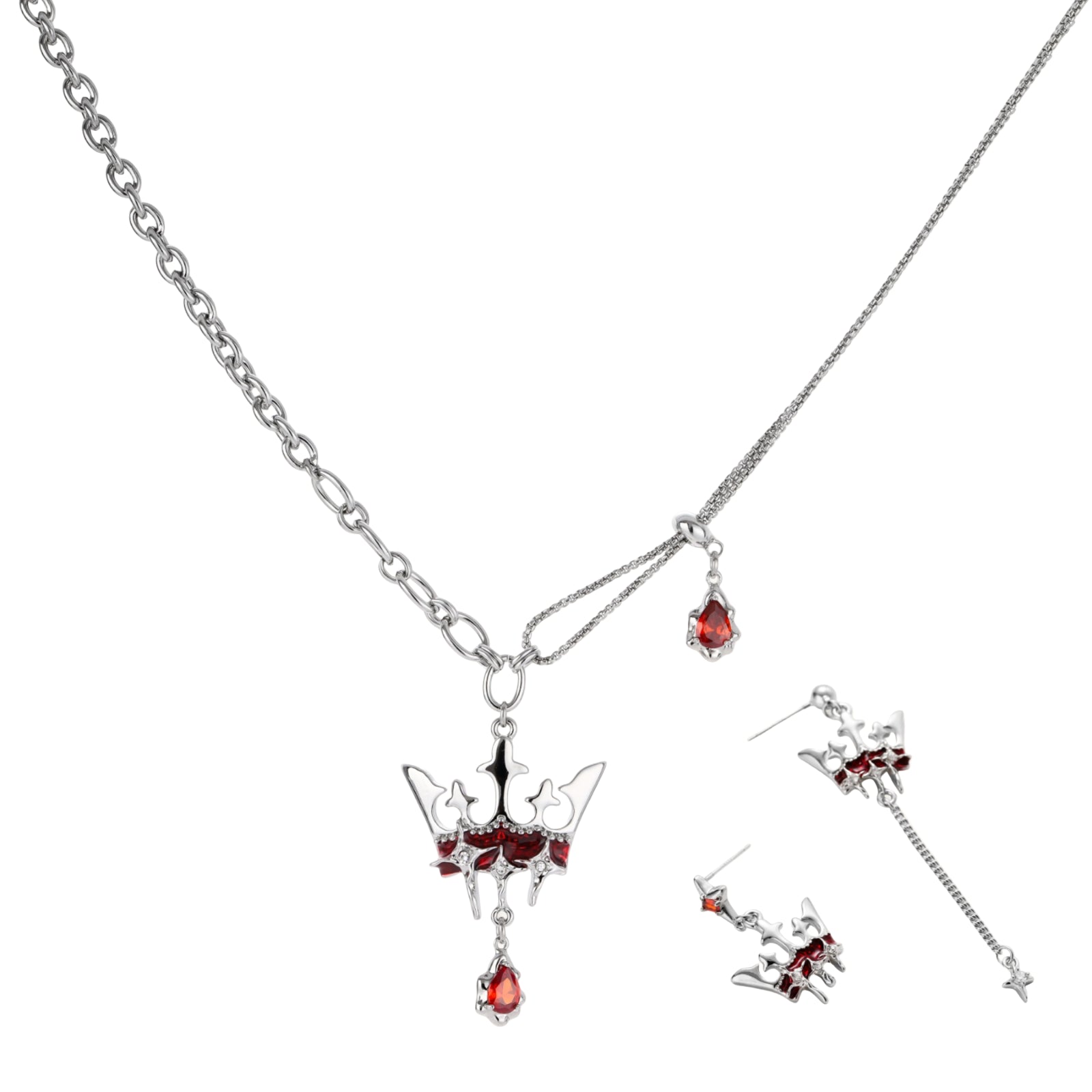 Silver-tone crown pendant with red zirconia stones and matching asymmetrical earrings on cream background