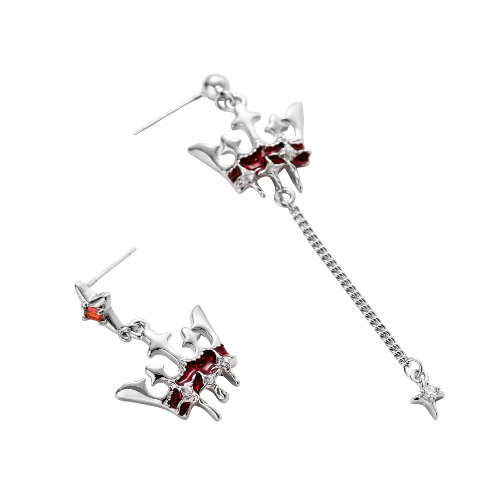 Silver-tone crown pendant with red zirconia stones and matching asymmetrical earrings on cream background