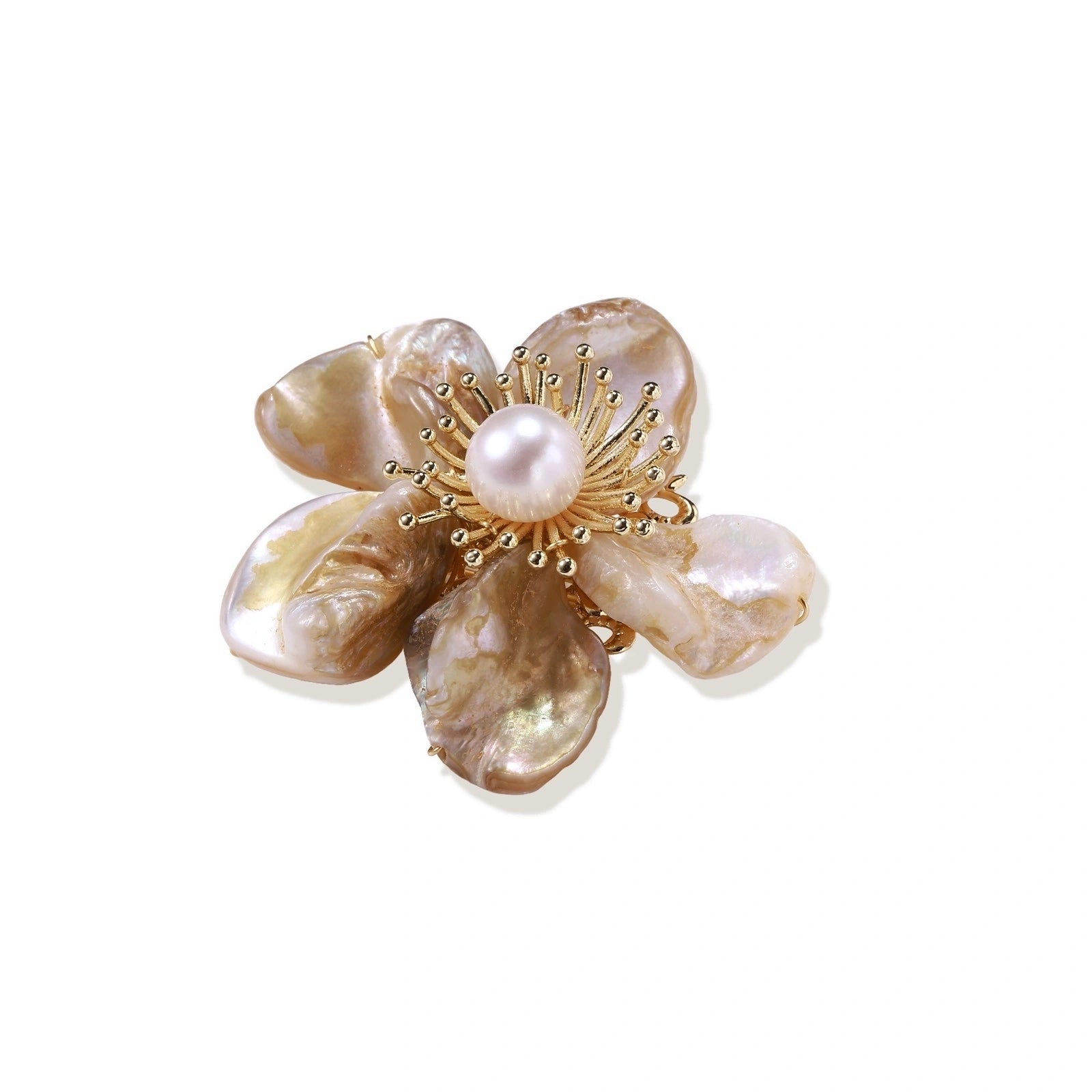 Flower-shaped brooch with iridescent shell petals, freshwater pearl center, and gold-plated radiating details.