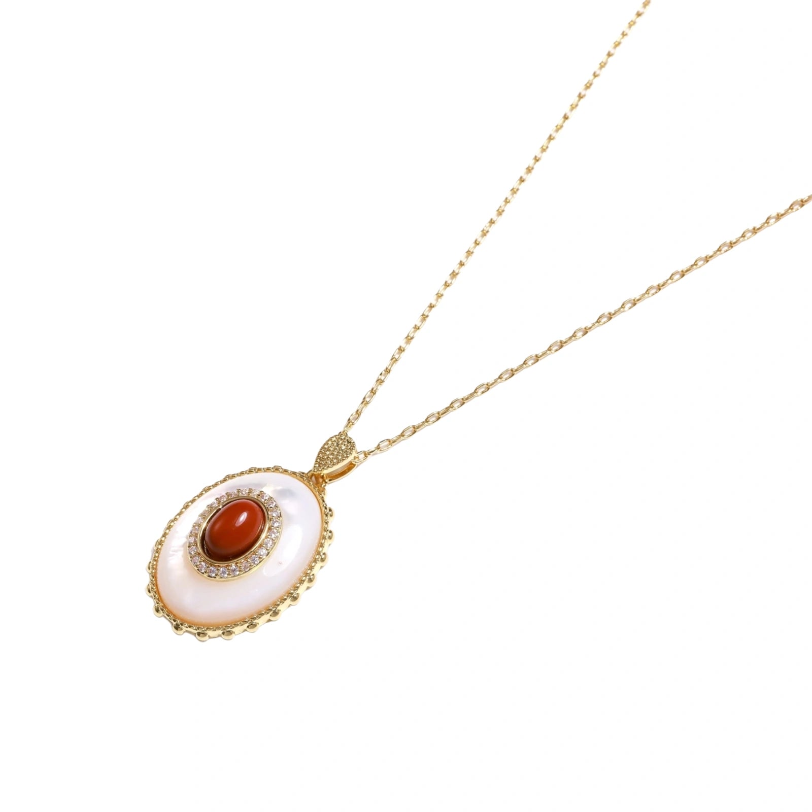 Gold pendant with oval mother-of-pearl frame, amber stone center, and crystal halo on delicate chain