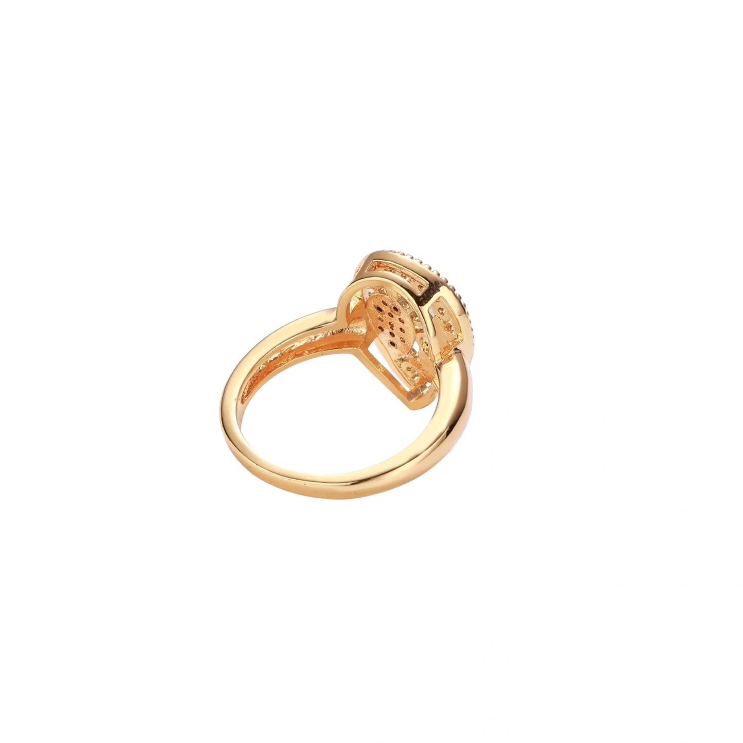 Teardrop-shaped gold-plated ring with turquoise enamel flowers and crystal pavé detail on cream background