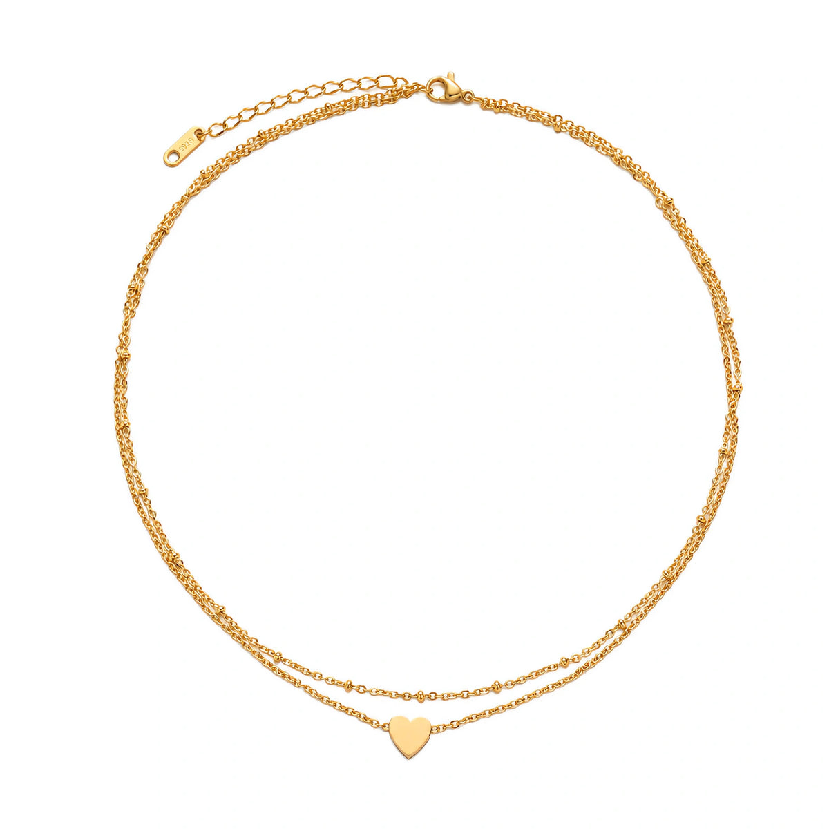 Delicate double-chain gold necklace with tiny heart pendant on cream background