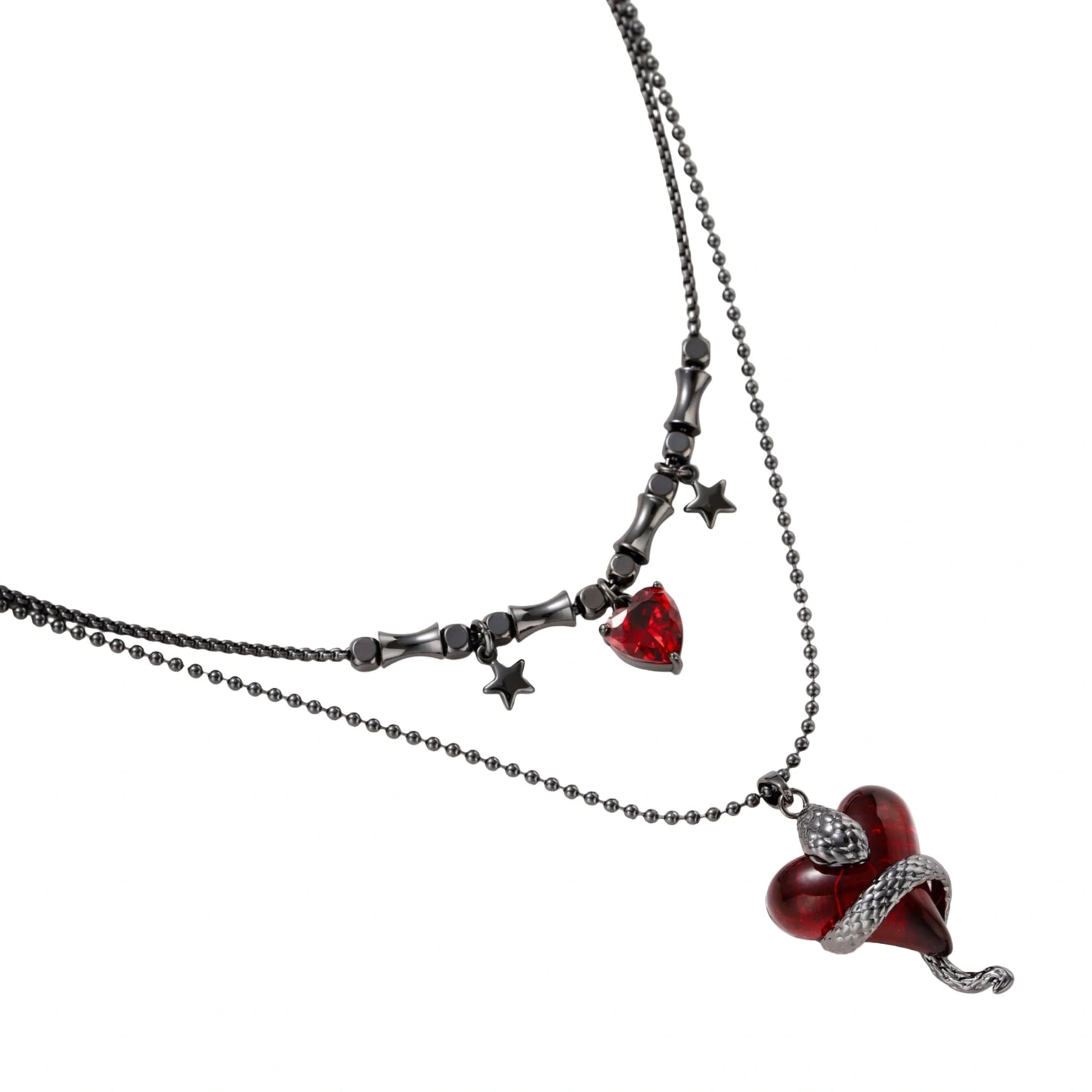 Gothic jewelry set with asymmetrical black metal earrings featuring red crescent moons, stars, and layered necklaces with heart pendants