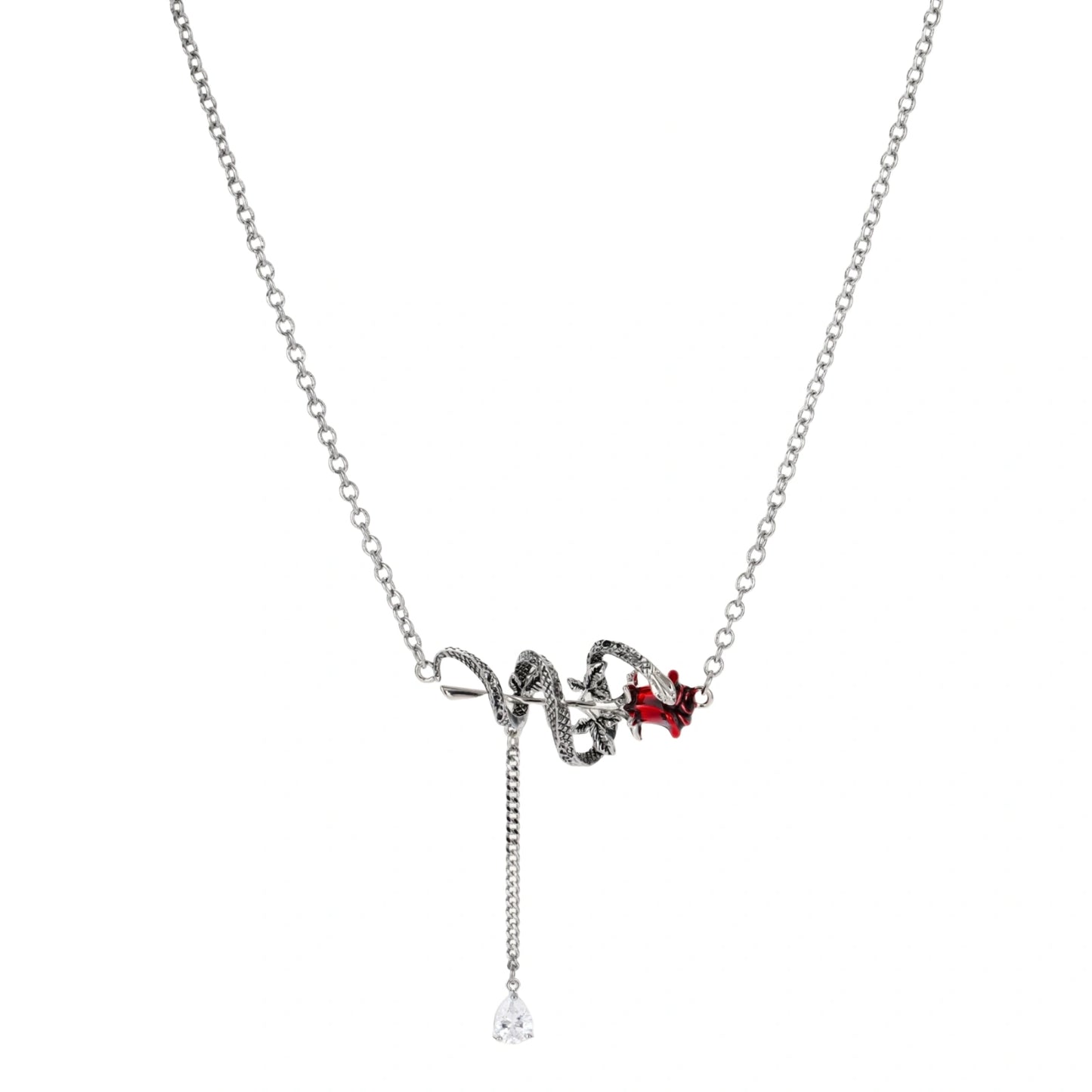 Gothic jewelry set with silver snake designs holding red enamel roses, featuring detailed leaf stems on cream background