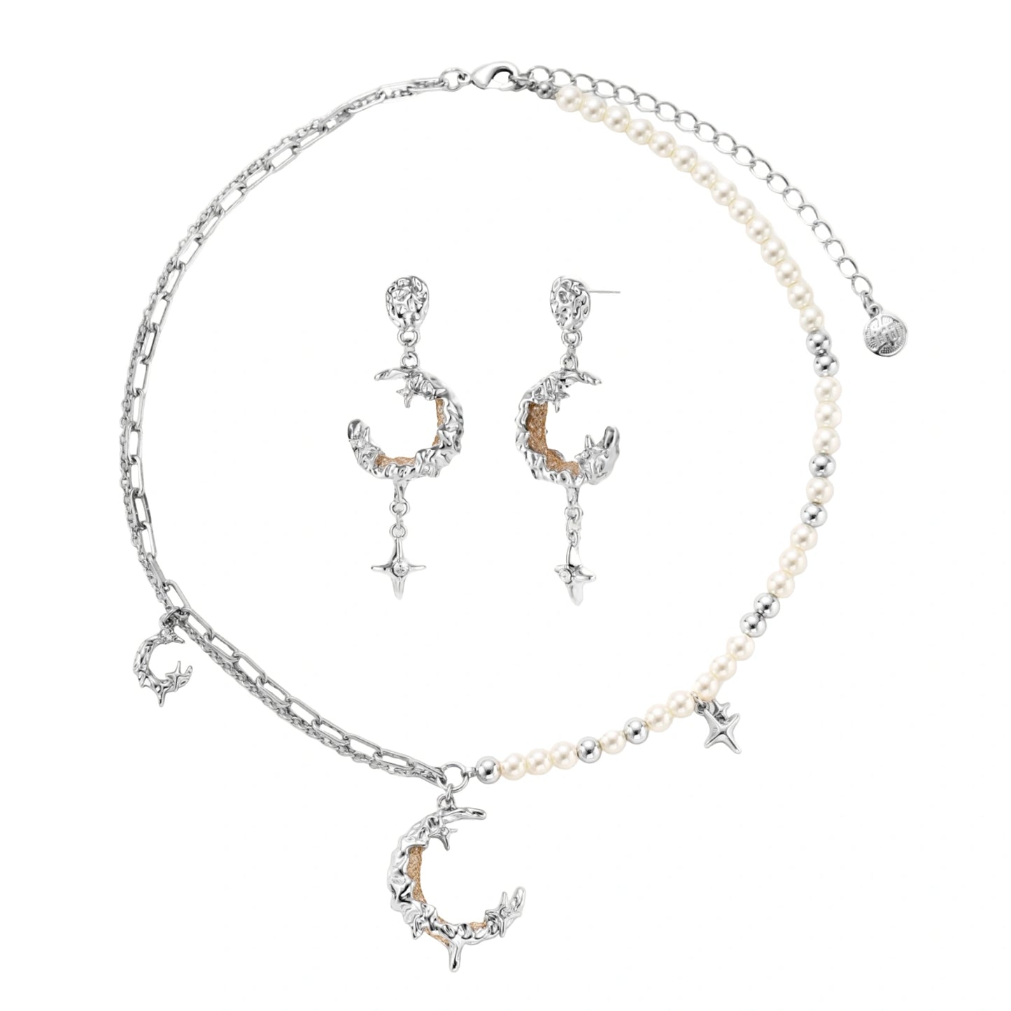 Mixed-metal jewelry set featuring layered necklaces with crescent moon pendant and pearl beads, plus matching star-drop earrings.