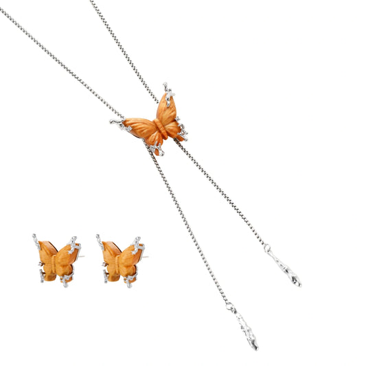Amber wood butterfly pendant necklace with dangling chains and matching carved wood butterfly earrings on white background.