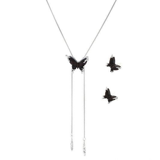 Dark wood butterfly earrings and necklace with silver chain accents on white background, showing natural grain texture.