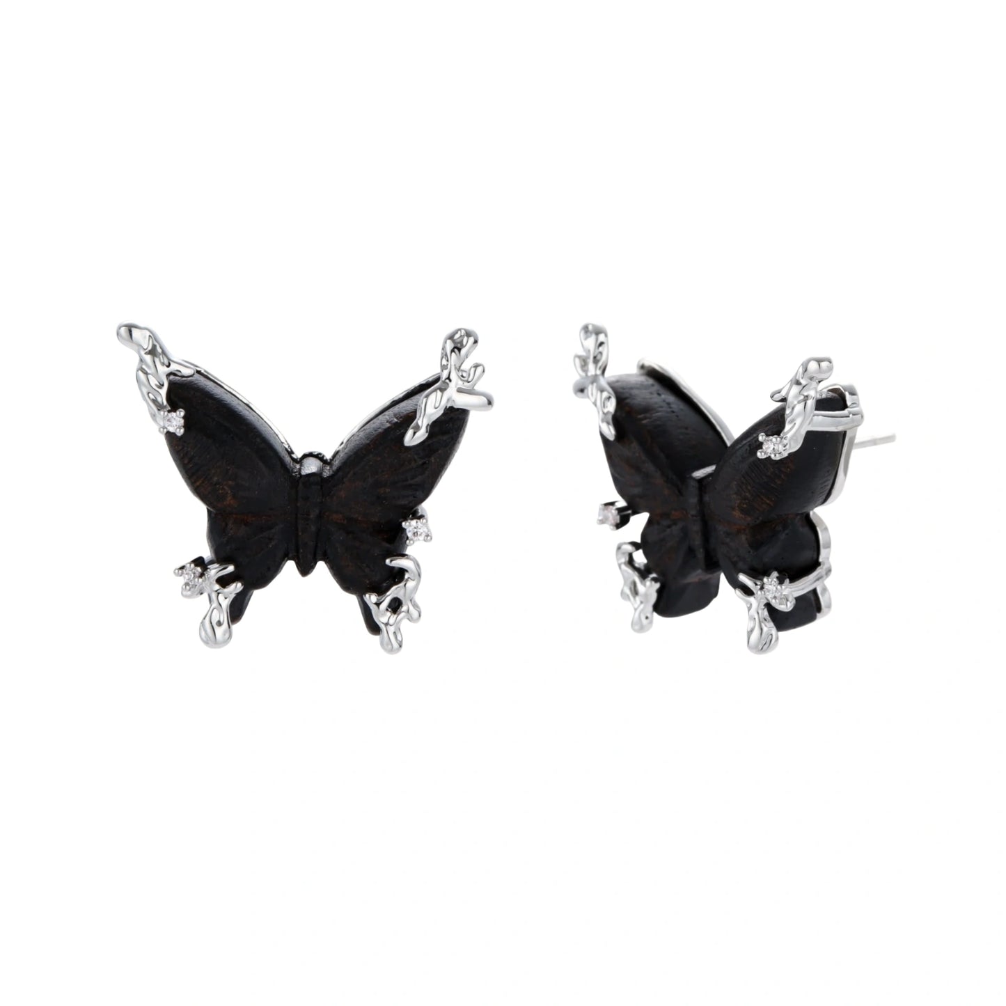Dark wood butterfly earrings and necklace with silver chain accents on white background, showing natural grain texture.