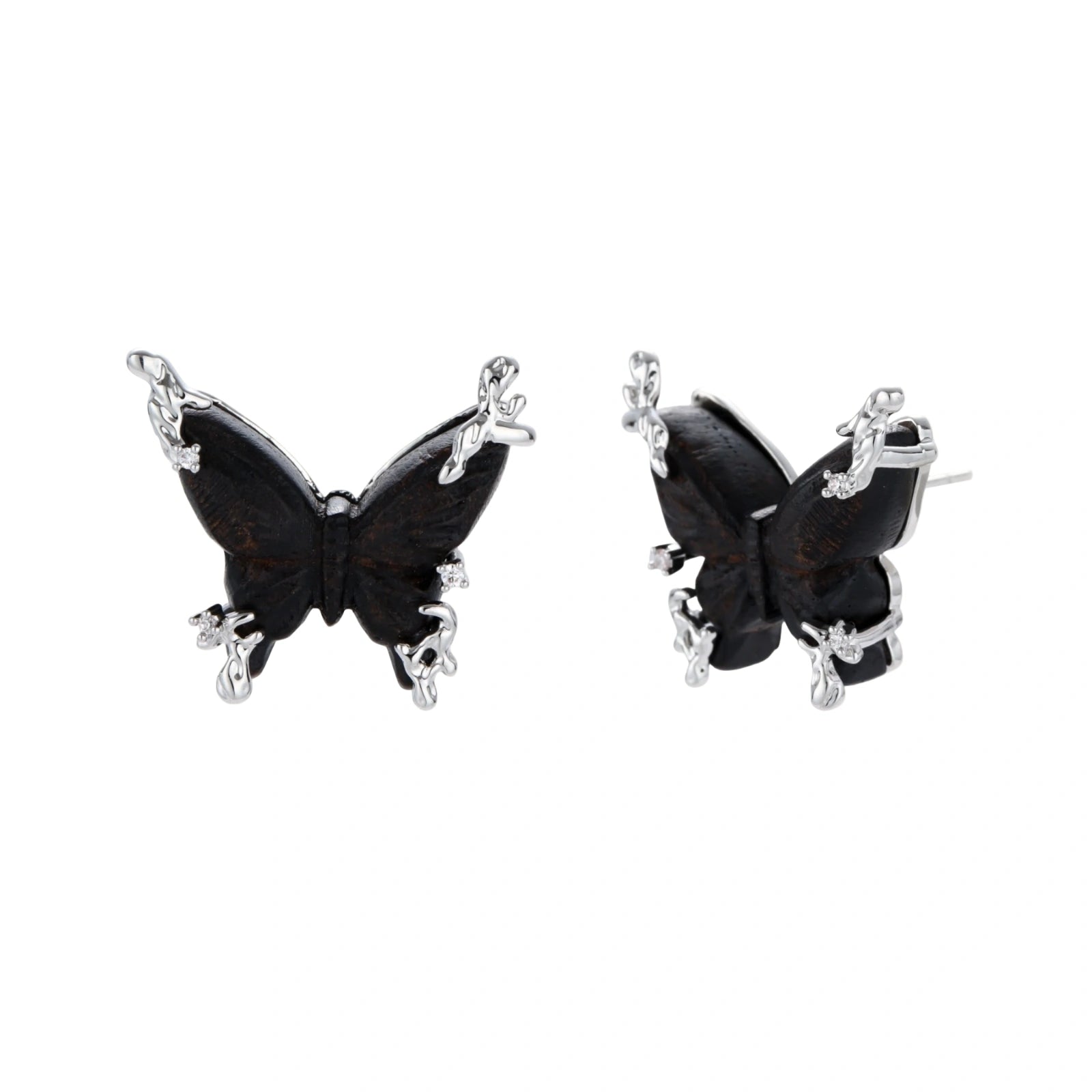 Dark wood butterfly earrings and necklace with silver chain accents on white background, showing natural grain texture.