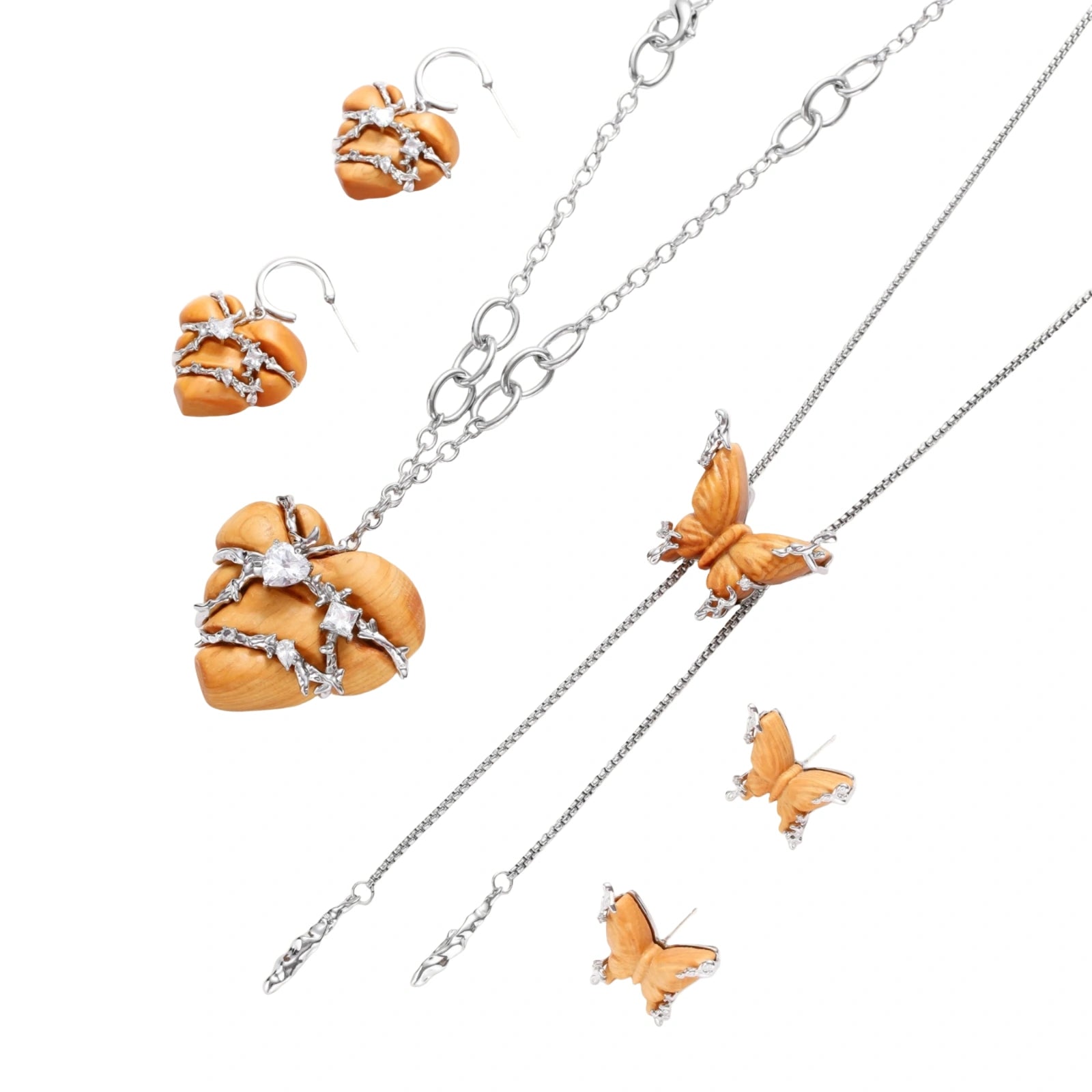Heart-shaped eco-brass and wood jewelry set with silver wire detailing and crystal accents on cream background.