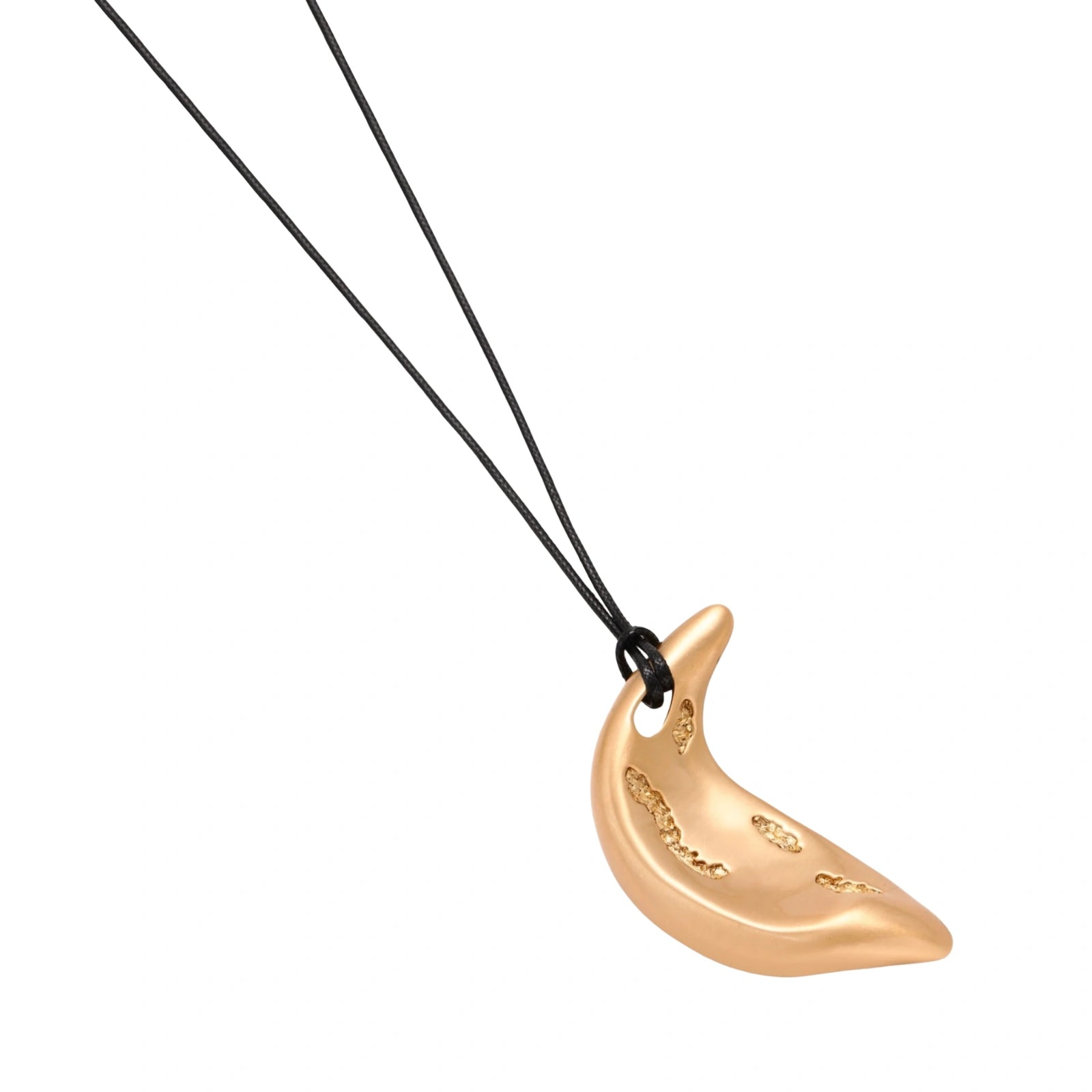Gold-toned crescent moon pendant with textured surface on black adjustable cord, displayed with matching crescent earrings