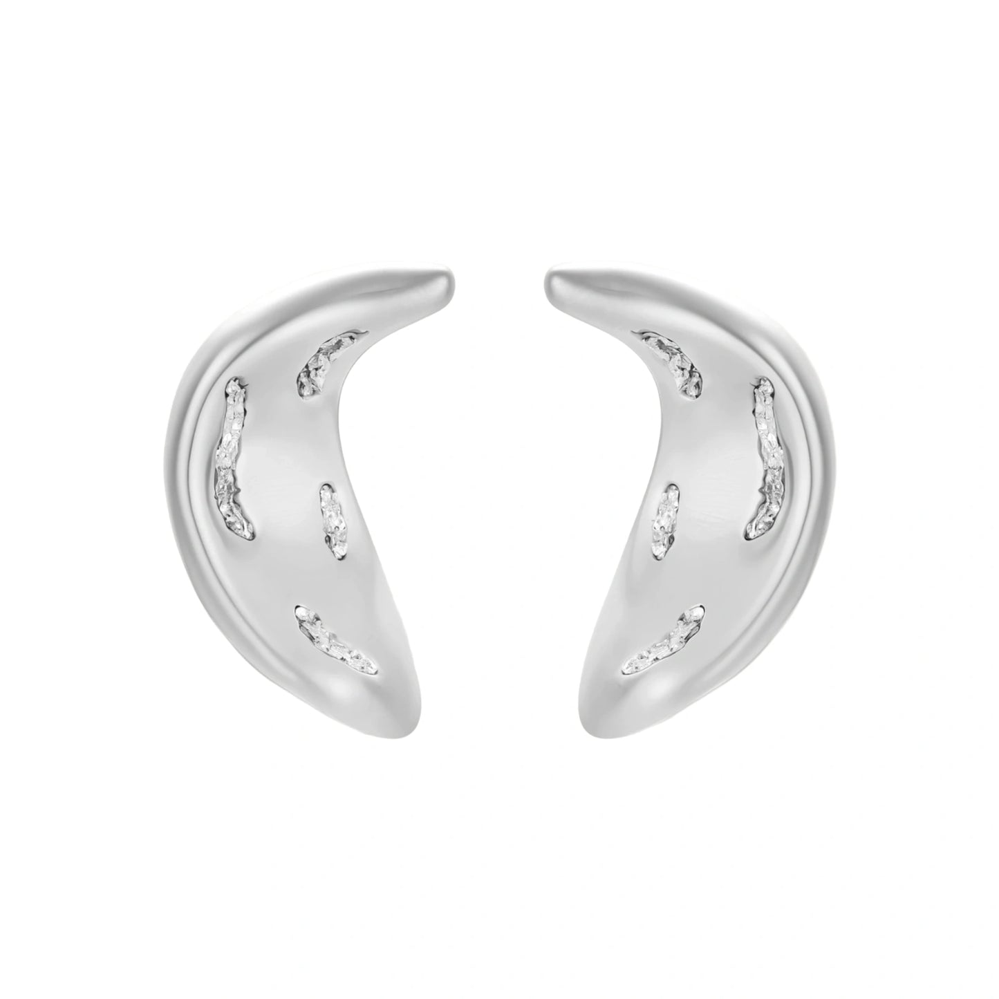 Crescent moon shaped pendant and earrings in eco-zinc alloy with curved crystal inlay patterns on light background.