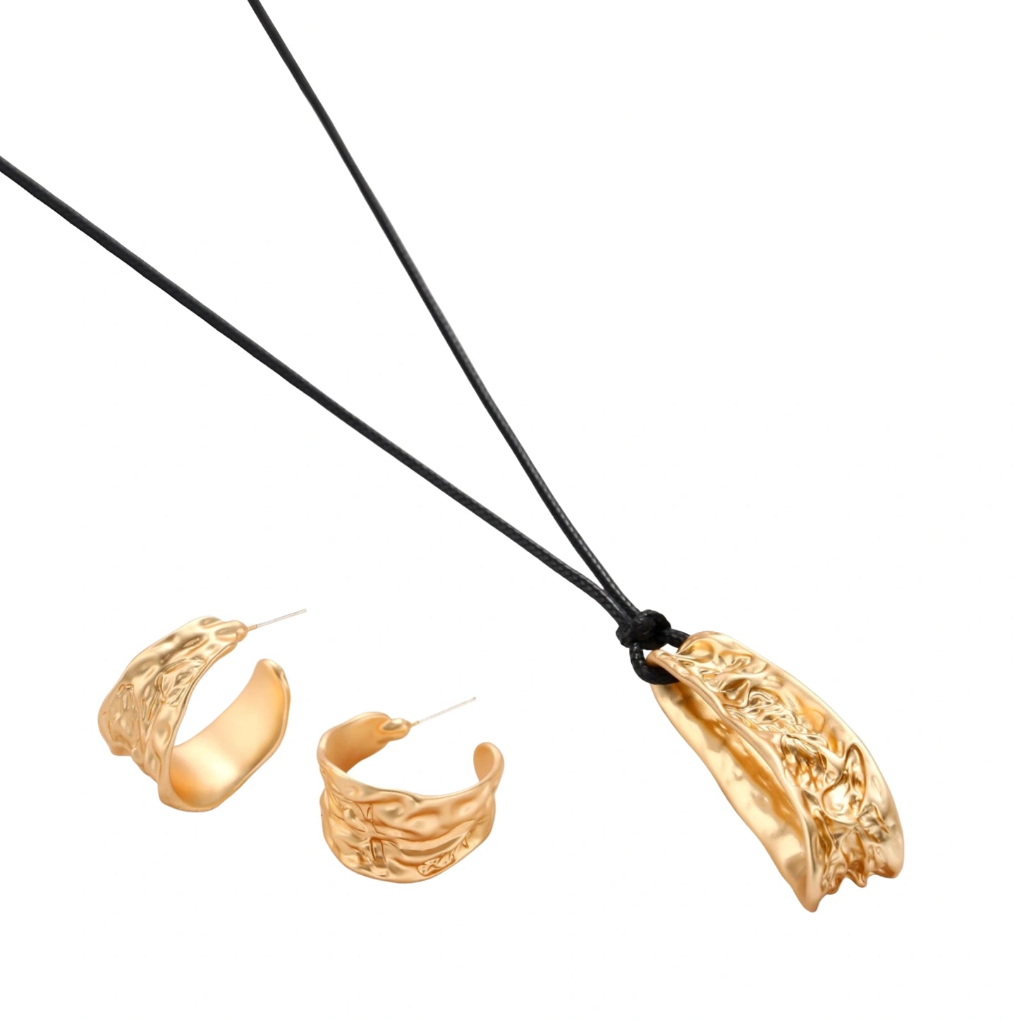 Gold-toned textured pendant necklace with matching hoop earrings featuring organic flowing patterns on white background.