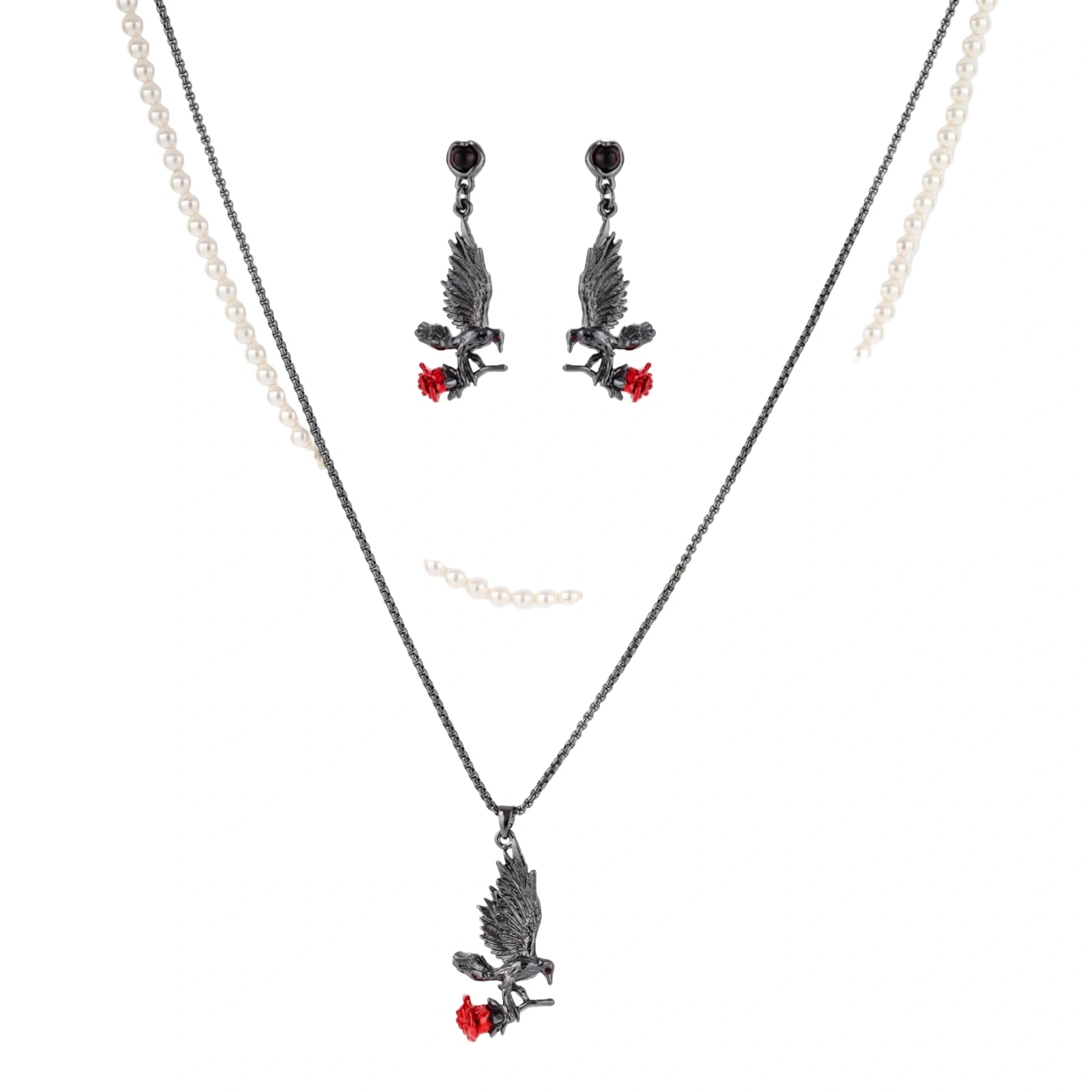 Dark gunmetal jewelry set featuring detailed raven pendants carrying red enamel roses with layered pearl and chain necklaces