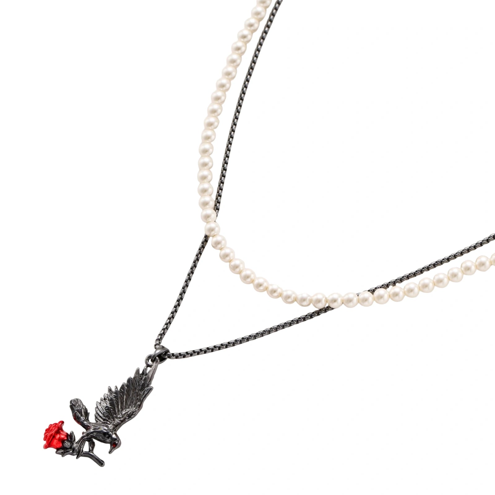 Dark gunmetal jewelry set featuring detailed raven pendants carrying red enamel roses with layered pearl and chain necklaces