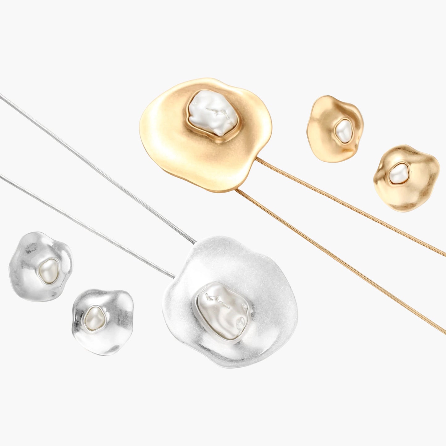 Organic silver stud earrings with white resin pearl centers in fluid stone-like shapes on light background.