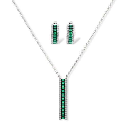 White gold plated jewelry set with emerald green rectangular stones and clear crystals in geometric rows on white background.