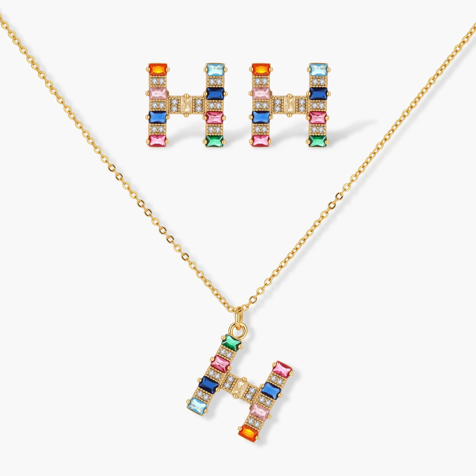 Gold-plated letter H jewelry set with multicolor zirconia stones in emerald cuts, showing necklace pendant and matching earrings